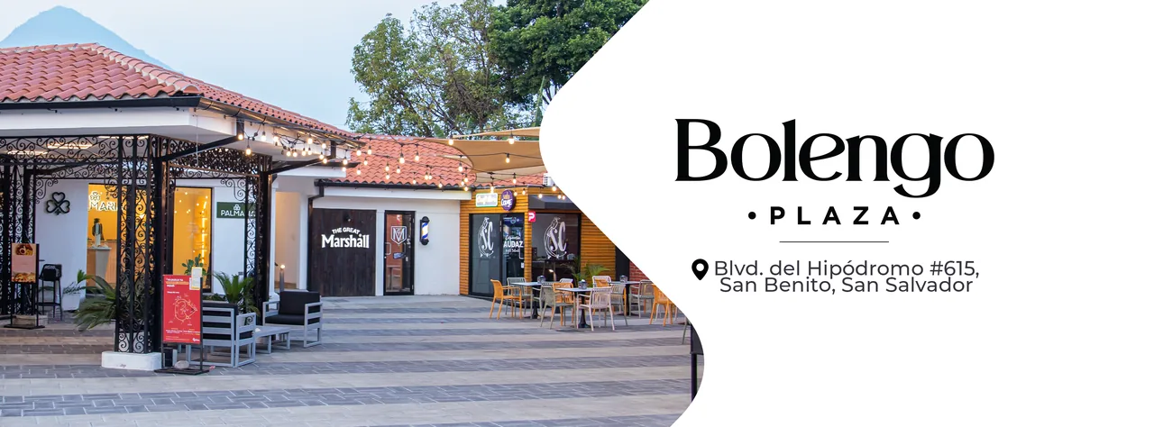 Bolengo Plaza al atardecer, con su logotipo y dirección: Boulevard El Hipódromo No. 615, San Benito, San Salvador.